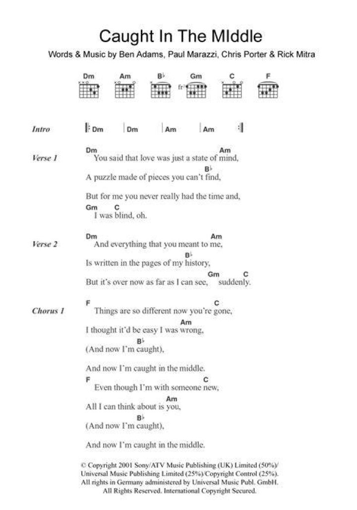 Caught up in the middle lyrics